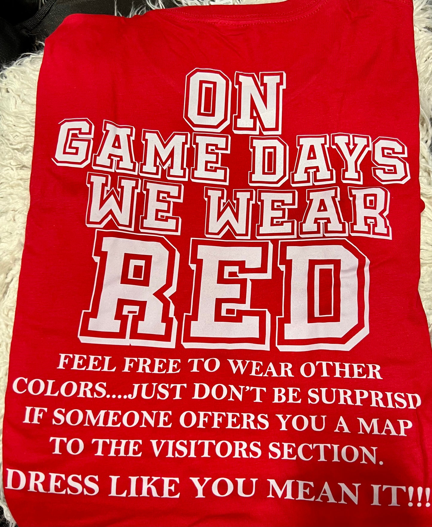 ON GAME DAYS WE WEAR RED