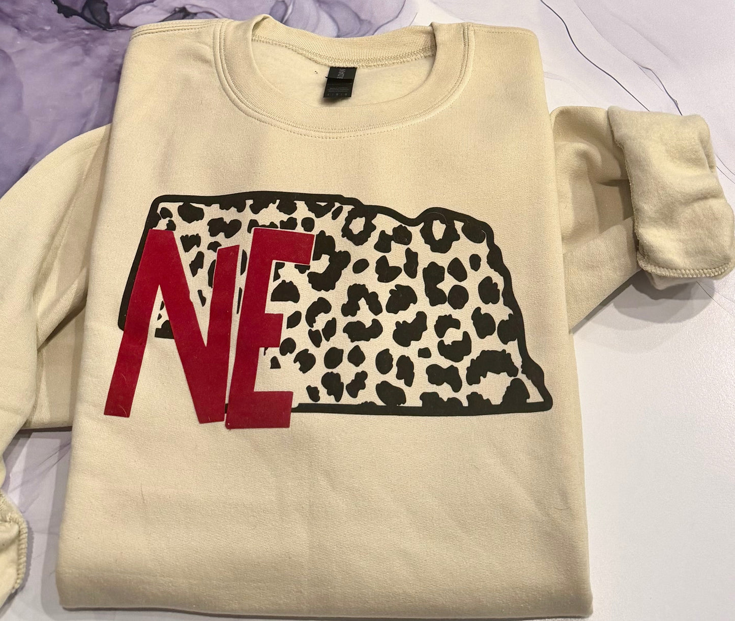 NE ANIMAL PRINT FLOCKED